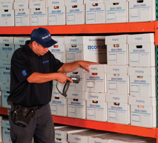 Corodata employee scanning storage boxes